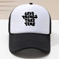 Close-up of GOOD THINGS TAKE TIME print on black and white mesh trucker hat - Black