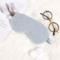 Light gray teddy plush sleep eye mask with elastic headband on cozy home background - Sky Blue