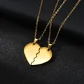 Macro shot of gold-plated titanium steel puzzle heart pendants for couples - Glossy / Gold Color (Couple Set)