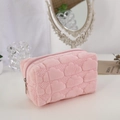 Detailed view of pink plush cosmetic bag with soft cloud texture and metal zipper - Pink