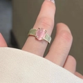 Minimalist gold moon ring with ridged texture featuring an oval pink gemstone - Pink Cat's Eye Ring