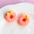 Macro detail of resin donut charms with yellow bows and sprinkles for DIY crafts - Small Bow - Orange Base + Yellow