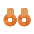 Macro detail of geometric hollow wood earrings in brown with concentric circular patterns - Style 46/Rounded Rect Concentric Circle