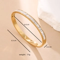 Golden titanium steel bangle with inlaid baguette zircons showing dimensions and weight - White Zirconia - Gold Plated