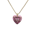 Detailed close-up of a pink heart pendant with evil eye motif and colorful gems on gold chain - Pink