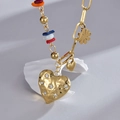 14K gold stainless steel necklace with colorful beads and textured rhinestone heart - Gold