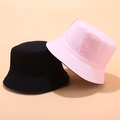 Close-up of black and pink reversible cotton bucket hats with fine brim stitching detail - M (56-58cm) / Black and Pink