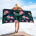 Detail showing high-quality microfiber beach towel with tropical hibiscus and palm leaf print - Deep Blue Hibiscus