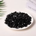 Polished black natural pebbles in a white plate for aromatherapy and home decoration - Obsidian (9-12mm) 100g