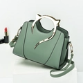 Sage green minimalist handbag featuring metallic cat ear handle and detachable strap - Light Green