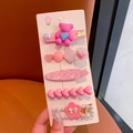 Detail view of 5-piece pink rhinestone hair clips set featuring pearls and floral motifs - Little Bear 5-Piece Set