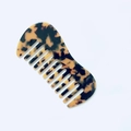 Portable acetate hair comb featuring a vintage tortoiseshell pattern and wide-tooth design - Leopard Print