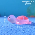 Pink turtle figurine detail showing 3.1cm length and 3.3g weight on blue sand - Luminous Light Pink