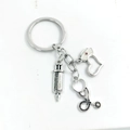 Macro detail of silver medical keychain with syringe, stethoscope and heart nurse hat charms - Style 5 (Flat Ring Silver 3-Piece Set)