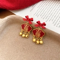 Detailed shot of New Chinese style lion earrings with lucky locks and red ribbon bows - Alloy/Silver Pin / Gold Bow Fu Lock With Bells (4#)