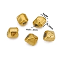 Macro detail of 5x5.5mm irregular gold stainless steel beads with 2mm hole for DIY jewelry - Style B / Gold