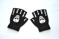 Detailed close-up of knit fingerless gloves featuring white skeleton hand and skull prints - Skull / Half Finger