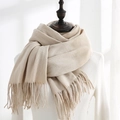 Elegant beige cashmere-feel winter scarf with soft fringes on a mannequin - Off-White