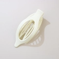 Matte cream hollow oval hair claw clip for thick hair styling, solid background view - Matte Cream White