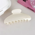 Close-up of a large cream white acrylic shark hair claw clip with a smooth glossy finish - Glossy White