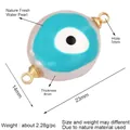 Flat oval freshwater pearl Evil Eye charm with gold loops and dimensions 23x14mm - Turquoise/Blue Eye Texture (L344504)