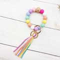 Detail of colorful silicone bead keychain with macrame tassel and natural wood hex bead - Macaron Multicolor