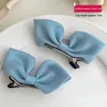 Set of two light blue bow hair clips with 5cm metal duckbill clips for girls - Blue Satin Bow Pair