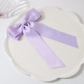 Elegant purple satin double-layered bow hair clip on a decorative white plate - Purple
