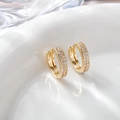 Detailed macro of gold-plated hoop earrings featuring triple-row micro-pave zircons - E5-518 Style / 14x14mm / Gold