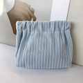 Detail view of a light blue corduroy pouch showing the textured fabric and drawstring closure - No Label Plain / Blue