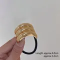 Minimalist gold curved metal hair tie with black elastic rope, size 4.0cm x 3.2cm - Three-layer Gold