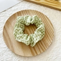 Green and white gingham pattern scrunchie hair tie on a decorative wooden tray - Dark Green Plaid