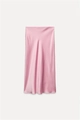 Detail view showing smooth satin fabric texture and drape of a pink midi skirt - XS / Pink