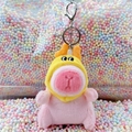 Pink Capybara plush keychain wearing a yellow duck hat with silver lobster clasp - Dragon Horn Hat Pink + Silver Clip