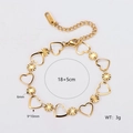 Bracciale minimalista in acciaio dorato con maglie a cuore e ciondoli a raggiera - Oro