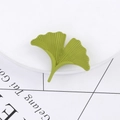 Elegant green ginkgo leaf brooch in high-quality finish on a minimalist display - Matte Grass Green Style (C2070-1)