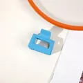 Detail of light blue matte square hair claw clip with minimalist hollow geometric design - Matte Peacock Blue