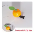 Detailed view of an orange sprout hair clip with size dimensions 3cm width and 2cm height - Orange Style
