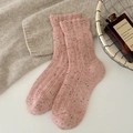 Pink flecked wool socks with ruffle edges in a cozy minimalist home aesthetic - Pink
