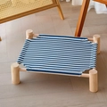 Blue and white striped canvas pet bed with solid wood frame elevated for cats and dogs - Blue Stripe