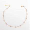 Bohemian gold chain necklace with pink crystal flower charms on white background - Transparent Purple Necklace