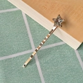 Detailed close-up of golden star hair clip with glittering silver rhinestones decoration - 3# Star Rhinestone Wave Bobby Pin
