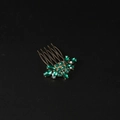 Golden hair comb accessory featuring green marquise and round cut crystals on black backdrop - Leaf Flower Hair Comb / Green Zircon