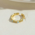 Detailed close-up of 14K gold plated evil eye ring with blue white enamel and crystals - White (JZ0377-1)