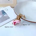 Cartoon brown dog brooch holding a pink heart bone on a white wooden background - Brooch / Labrador Biting Pillow