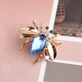 Golden honey bee brooch featuring a large teardrop blue crystal and sparkling rhinestones - Dark Blue