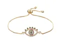 Adjustable golden evil eye bracelet with white crystal eyelashes and blue stone core - Gold Eyelash Eye