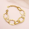 Gold plated stainless steel chunky chain bracelet with hammered oval links on pink background - Hammered Oval Links