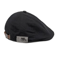 Detalle de gorra plana negra con correa de cuero marrón ajustable y hebilla de metal - M (56-58cm) / Negro
