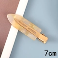 Detail view of a 7cm cream marble acetate hair clip with a golden metal base - 2# Acetate 7cm Seamless Clip